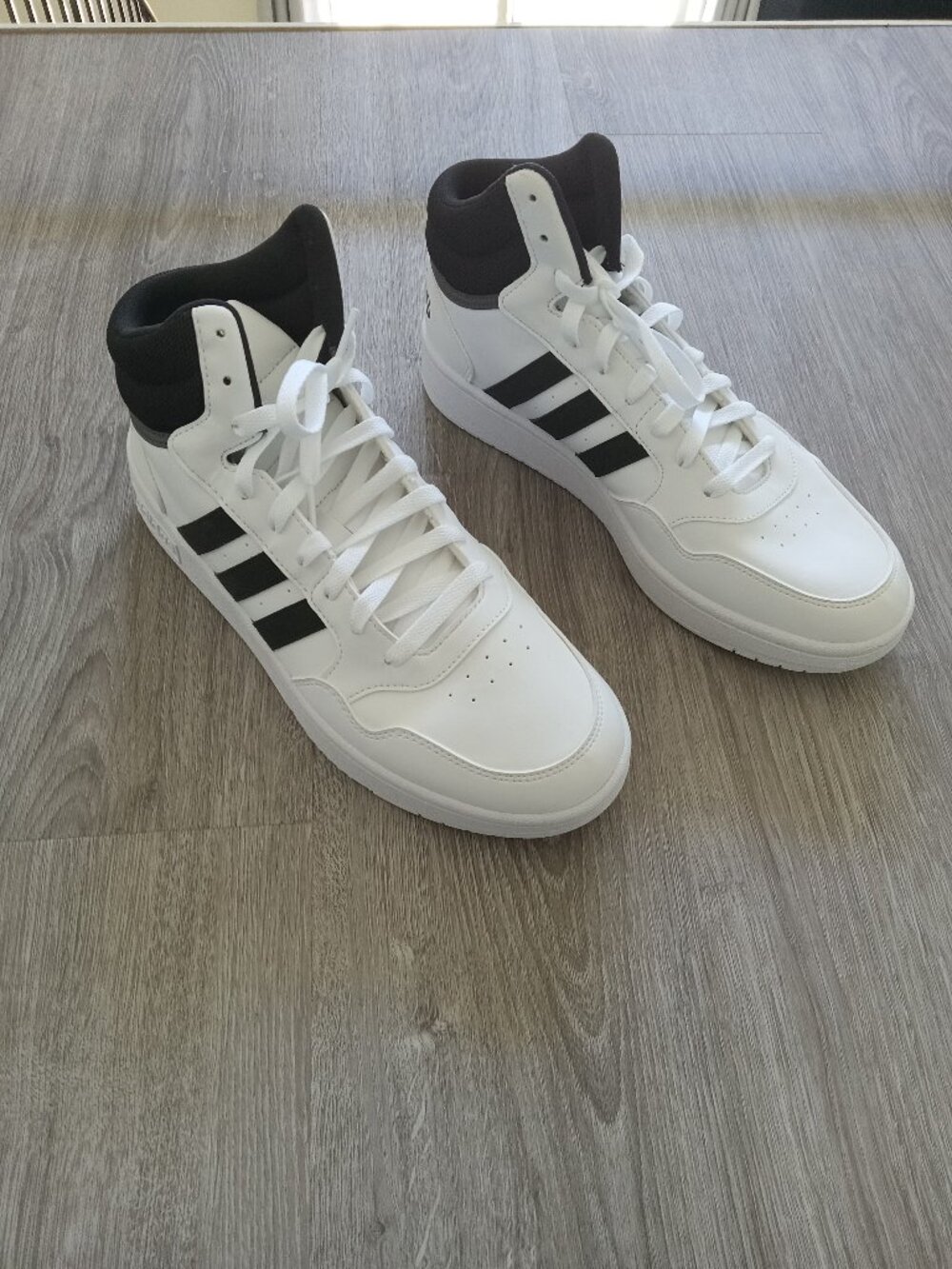 Brand new Adidas Hoops 3.0 Mid sneakers in Men's Size 10.